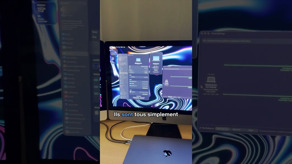 Un iMac 5K qui affiche le bureau du MacBook Pro posé devant lui